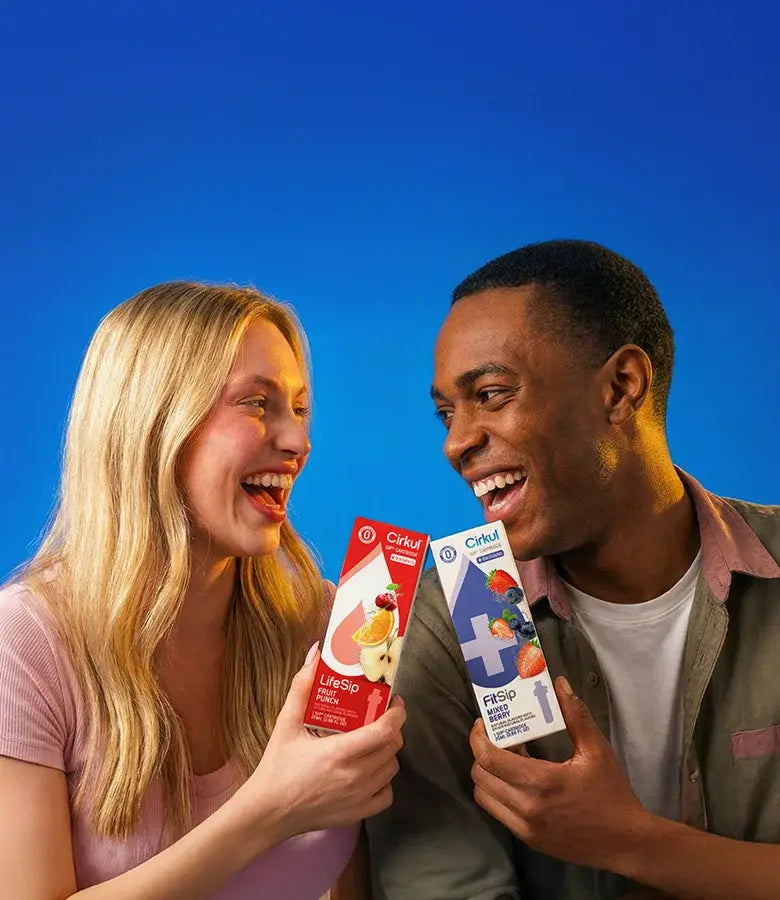 Man and woman holding Cirkul cartridges